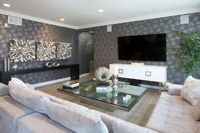 Large trendy open concept ceramic tile and gray floor living room photo in Los Angeles with gray walls and no fireplace