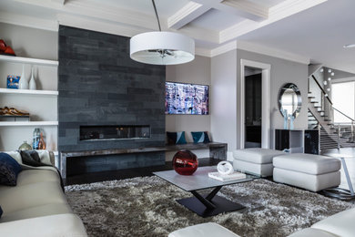Inspiration for a large contemporary formal open plan living room in Raleigh with grey walls, dark hardwood flooring, a standard fireplace, a tiled fireplace surround, a wall mounted tv, brown floors and a coffered ceiling.