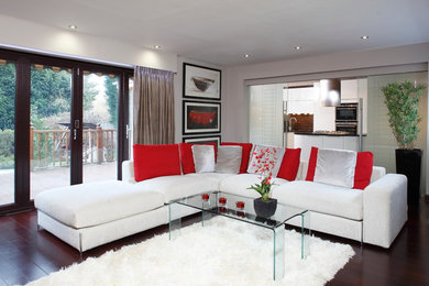 Inspiration for a contemporary living room in Other with beige walls and medium hardwood flooring.