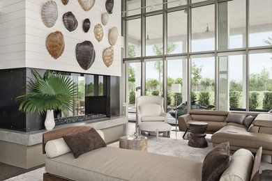 Стильный дизайн: парадная, открытая гостиная комната в современном стиле с белыми стенами и двусторонним камином без телевизора - последний тренд