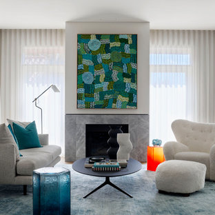 Large contemporary living room in Sydney with medium hardwood floors, a standard fireplace and brown floor.