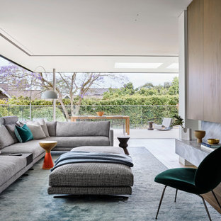Inspiration for a large contemporary living room in Sydney with medium hardwood floors and brown floor.