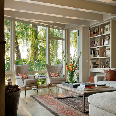 Elegant medium tone wood floor living room photo in Seattle