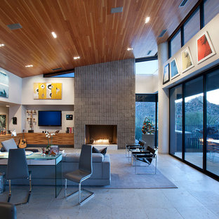 Inspiration for a large contemporary open concept and formal living room remodel in Phoenix with white walls, a standard fireplace, a stone fireplace and a wall-mounted tv