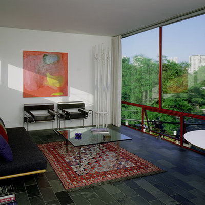 Example of a mid-sized trendy enclosed living room design in Chicago with white walls