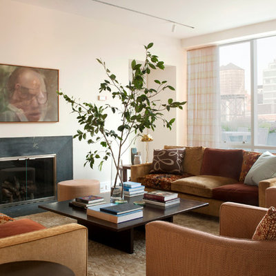 Trendy living room photo in New York with beige walls and a standard fireplace