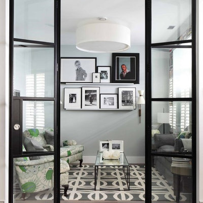 Example of a small trendy enclosed living room design in London with gray walls, no fireplace and no tv