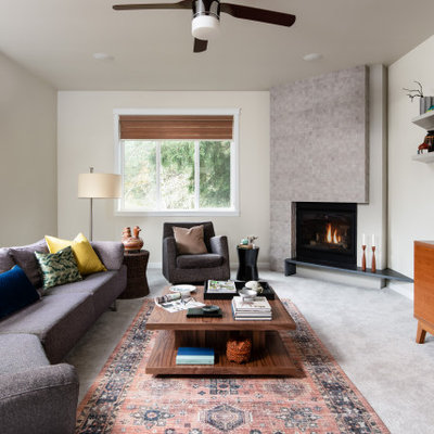 Mid-sized trendy open concept carpeted and gray floor living room photo in Seattle with white walls, a corner fireplace, a tile fireplace and a wall-mounted tv
