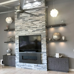 Living room - large contemporary open concept ceramic tile and beige floor living room idea in Miami with gray walls, a standard fireplace, a stone fireplace and a media wall