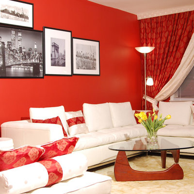 Example of a trendy living room design in New York with red walls