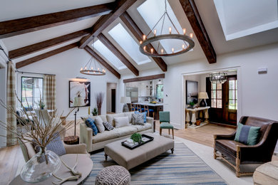 Living room - large transitional open concept light wood floor living room idea in Denver with white walls