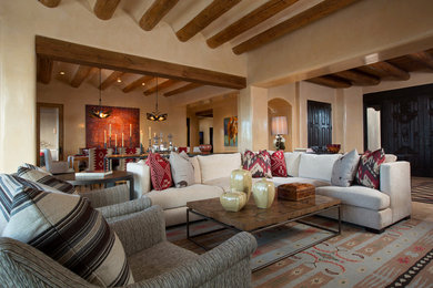 Inspiration for a mid-sized southwestern open concept living room remodel in Albuquerque with beige walls