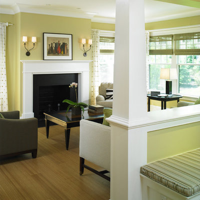 Ornate living room photo in Boston with yellow walls, a standard fireplace and no tv