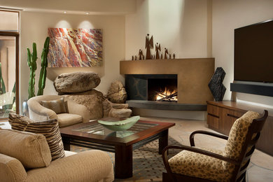 フェニックスにある高級な広いコンテンポラリースタイルのおしゃれなLDK (ベージュの壁、コーナー設置型暖炉、コンクリートの暖炉まわり、壁掛け型テレビ) の写真