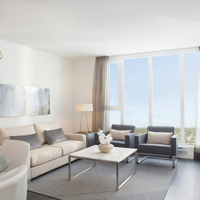 Example of a trendy living room design in Vancouver with white walls and a wall-mounted tv