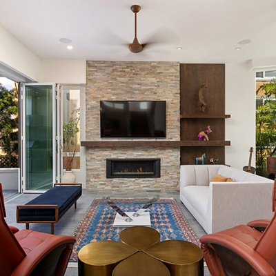 Living room library - mid-sized transitional enclosed gray floor and porcelain tile living room library idea in San Diego with white walls, a wall-mounted tv, a ribbon fireplace and a stone fireplace