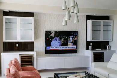 Small trendy open concept living room photo in Miami with a media wall