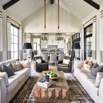 Example of a transitional open concept carpeted and gray floor living room design in Other with gray walls