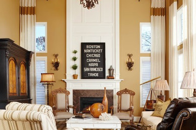 Example of a classic formal living room design in Detroit with yellow walls and a standard fireplace