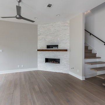 Corner fireplace with floating stairs