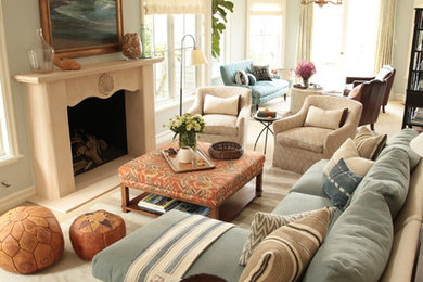 Living room - mid-sized coastal open concept carpeted living room idea in Orange County with blue walls, a standard fireplace, a plaster fireplace and no tv
