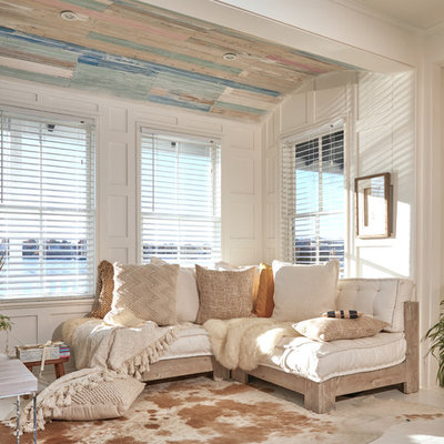 Example of a small cottage chic open concept painted wood floor and white floor living room design in Providence with white walls
