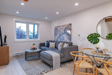 Living room - mid-sized transitional open concept living room idea in Vancouver with white walls