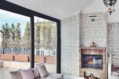 Living room - mid-sized rustic open concept light wood floor living room idea in Other with a bar, white walls, a standard fireplace and a brick fireplace