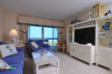 Photo of a large traditional formal enclosed living room in Tampa with white walls, carpet, no fireplace and a built-in media unit.