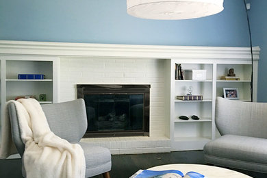 Mid-sized trendy formal and open concept dark wood floor living room photo in Denver with blue walls, a brick fireplace and a standard fireplace