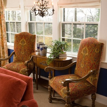 Cozy spot with velvet paisley chairs, iron chandelier