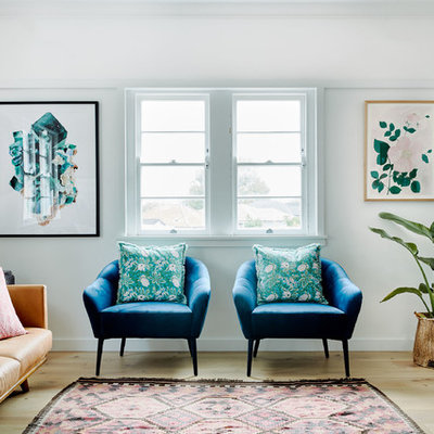 Living room - 1960s formal and enclosed light wood floor living room idea in Sydney with white walls