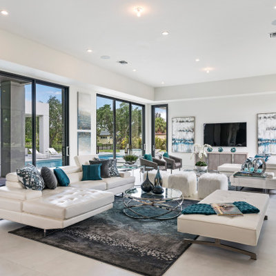 Inspiration for a contemporary open concept white floor living room remodel in Miami with white walls, no fireplace and a wall-mounted tv