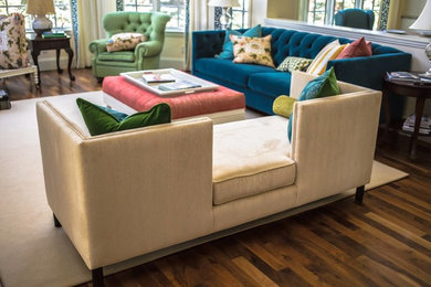 Modern formal open plan living room in Denver with beige walls and dark hardwood flooring.