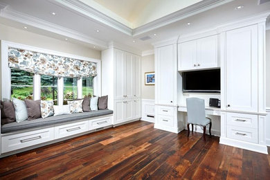 Living room - mid-sized traditional formal and open concept medium tone wood floor living room idea in Toronto with white walls, a media wall and no fireplace