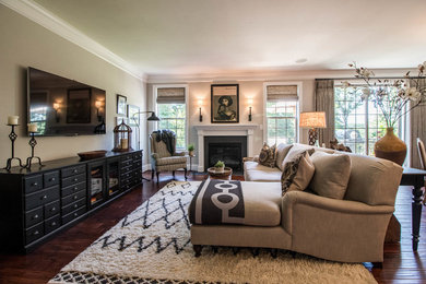 Example of a mid-sized transitional open concept dark wood floor living room design in Other with beige walls, a standard fireplace, a stone fireplace and a wall-mounted tv