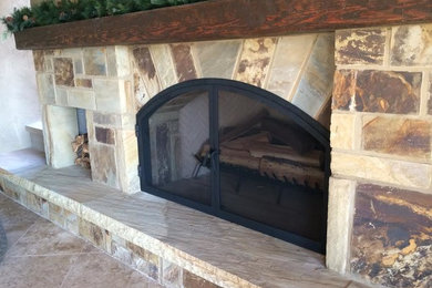 Inspiration for a large rustic living room remodel in Other with a standard fireplace and a stone fireplace