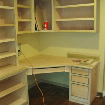 Custom Home Office with Shelves and storage set in Living Room  (unfinished, ins