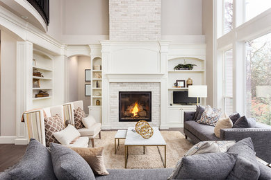 Living room - large transitional formal and open concept dark wood floor and brown floor living room idea in Dallas with gray walls, a standard fireplace, a brick fireplace and no tv