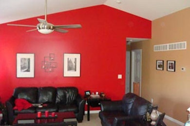 Modelo de salón de tamaño medio con paredes rojas y moqueta