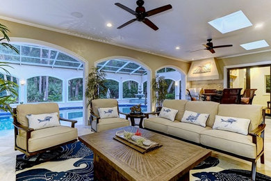 Example of a mid-sized eclectic formal and enclosed porcelain tile and beige floor living room design in Tampa with beige walls, a standard fireplace, a stone fireplace and no tv
