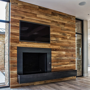 Custom pecan wall w fireplace and tv