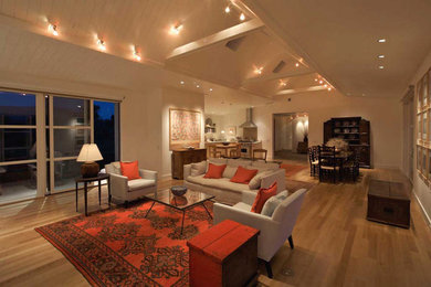 Example of a mid-sized trendy open concept and formal light wood floor and brown floor living room design in Denver with beige walls, no tv and no fireplace
