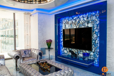 This is an example of a large modern formal open plan living room in Miami with white walls and a wall mounted tv.