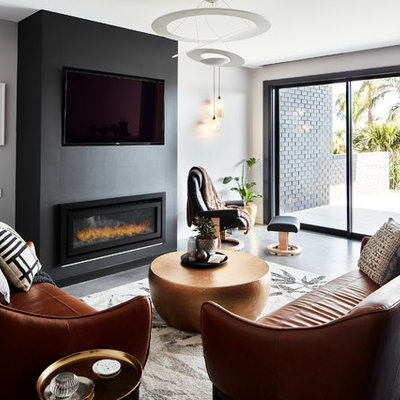 Inspiration for a contemporary formal and enclosed gray floor living room remodel in Sydney with gray walls, a ribbon fireplace and a wall-mounted tv