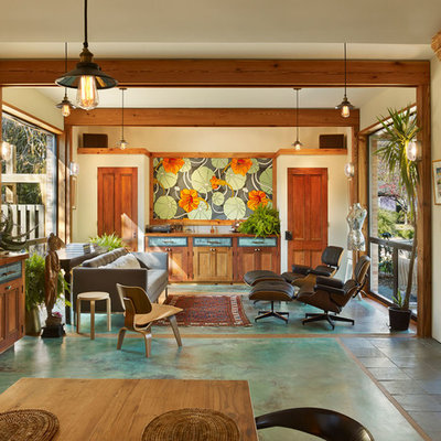 Living room - tropical open concept living room idea in New York with beige walls and no fireplace