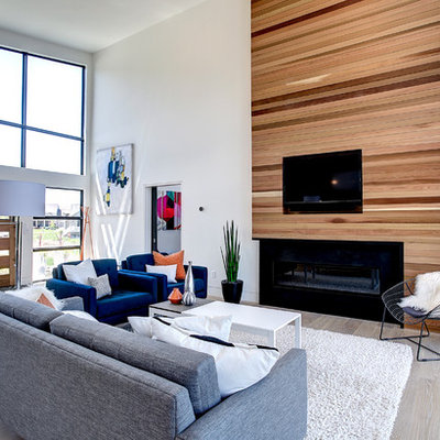 Mid-sized trendy open concept and formal light wood floor living room photo in Grand Rapids with white walls, a ribbon fireplace, a wall-mounted tv and a wood fireplace surround