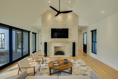 Example of a farmhouse living room design in Dallas