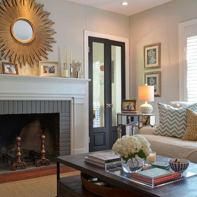 Living room - traditional living room idea in Dallas with gray walls, a standard fireplace and a brick fireplace