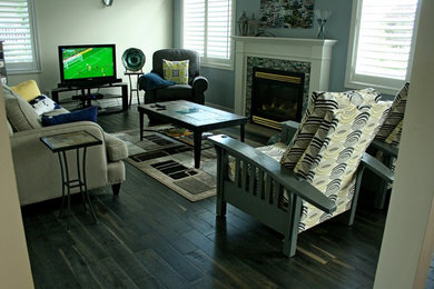 Example of a mid-sized mountain style open concept dark wood floor living room design in Toronto